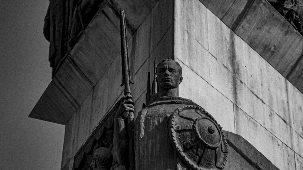 statue with a sword and shield