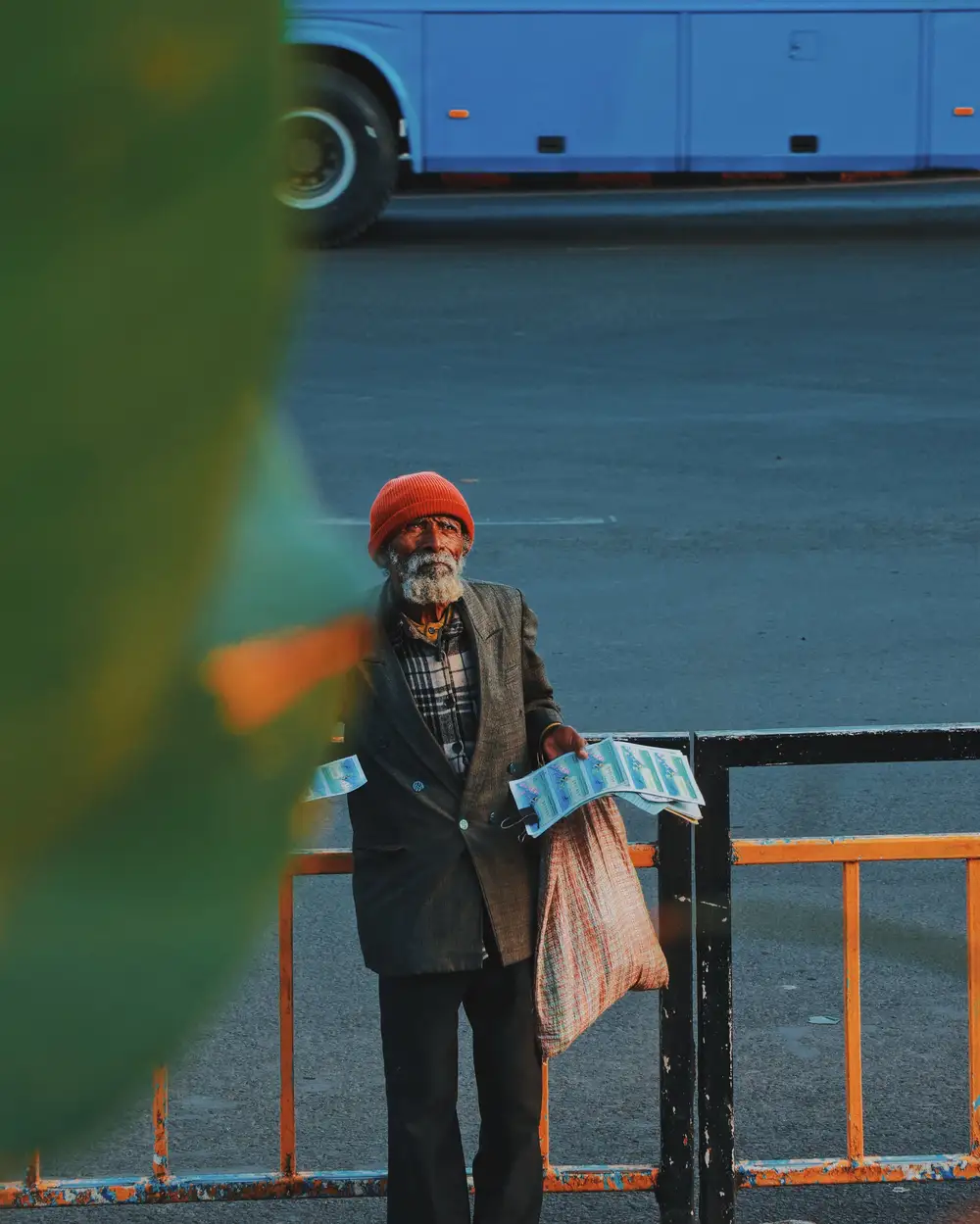 man carrying bags and papers