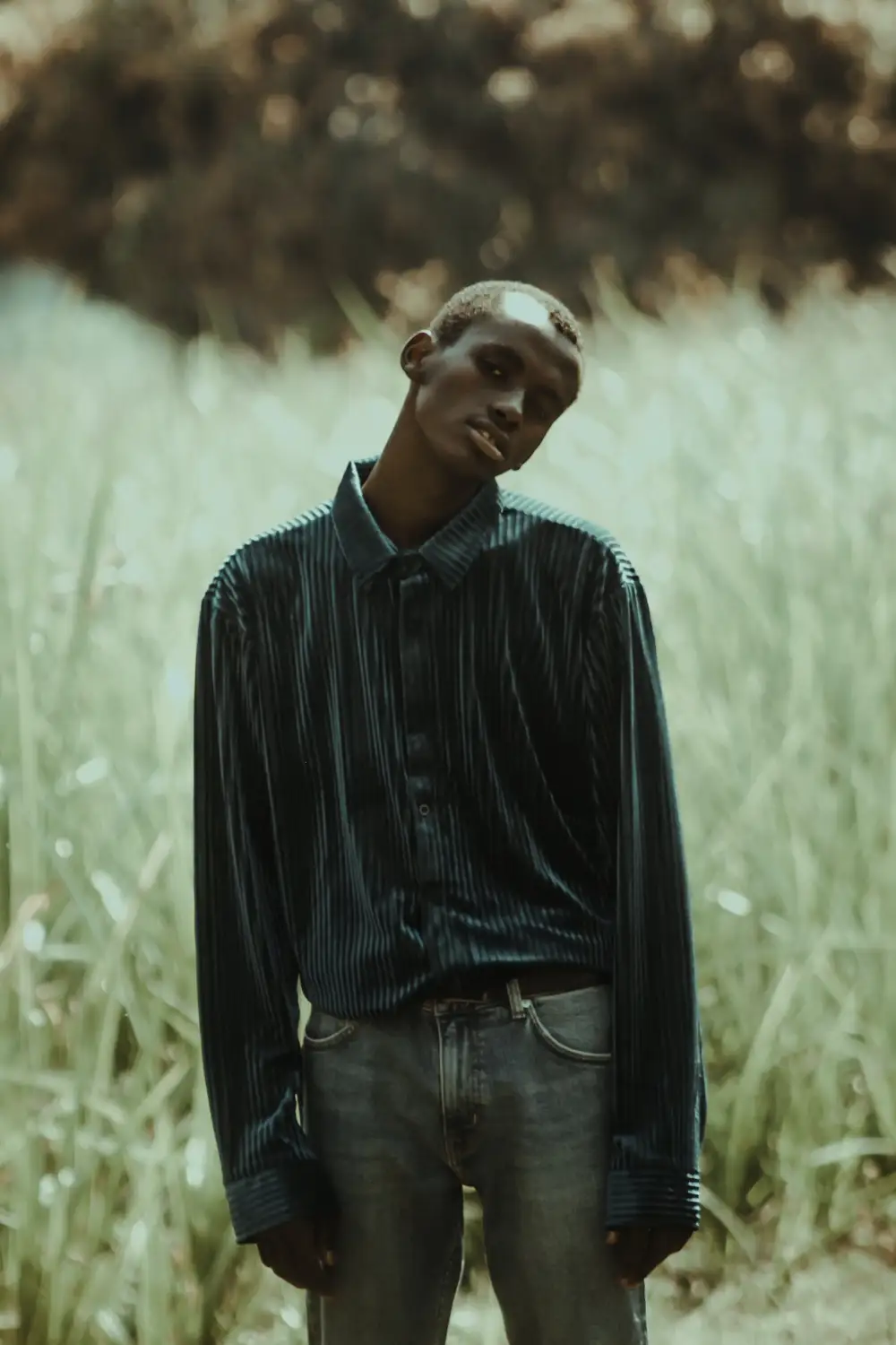 Man in Striped Shirt Outdoors