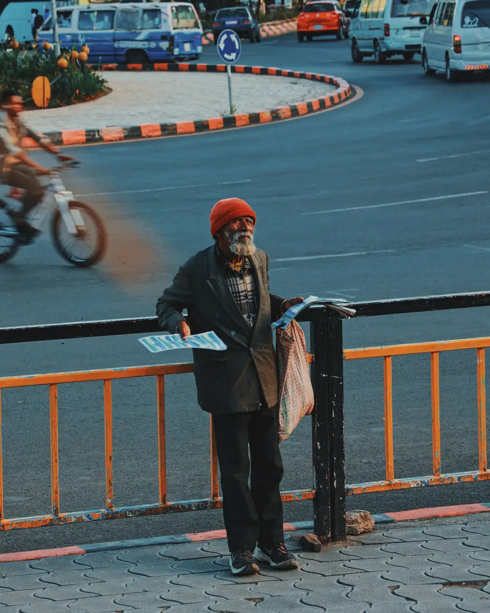 man holding posters on the street