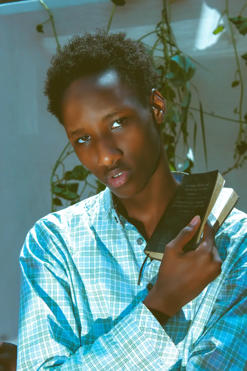 Young Man Holding Bible