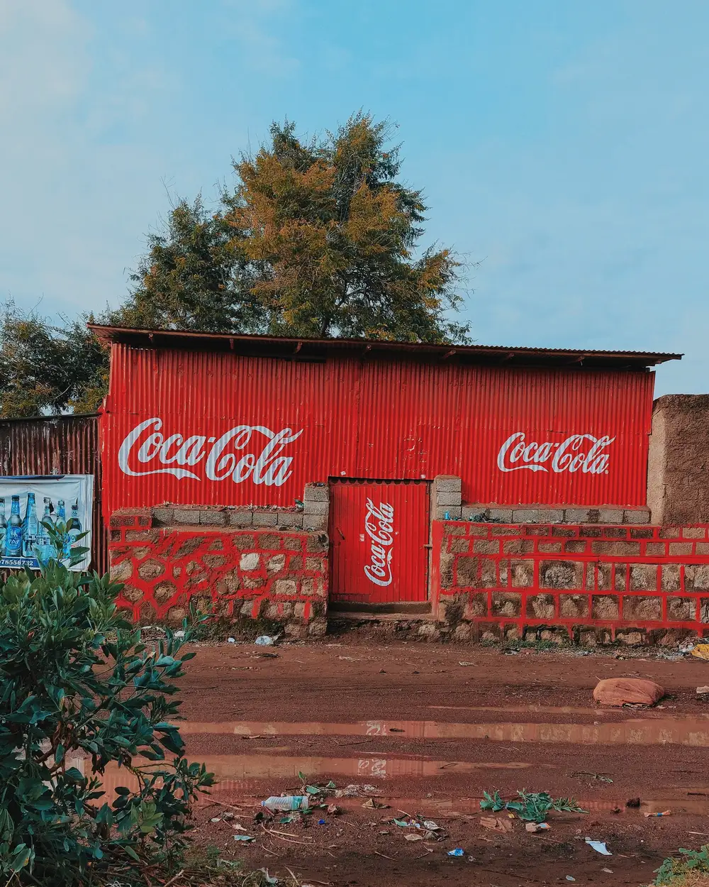 A red house branded with the CocaCola logo