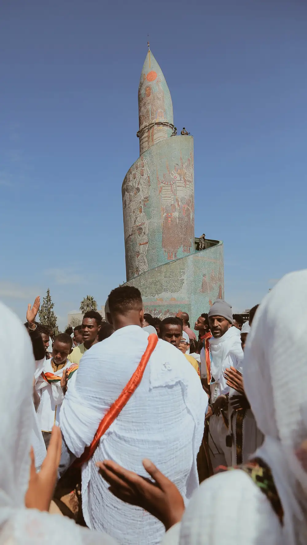 men in a crowd wearing white