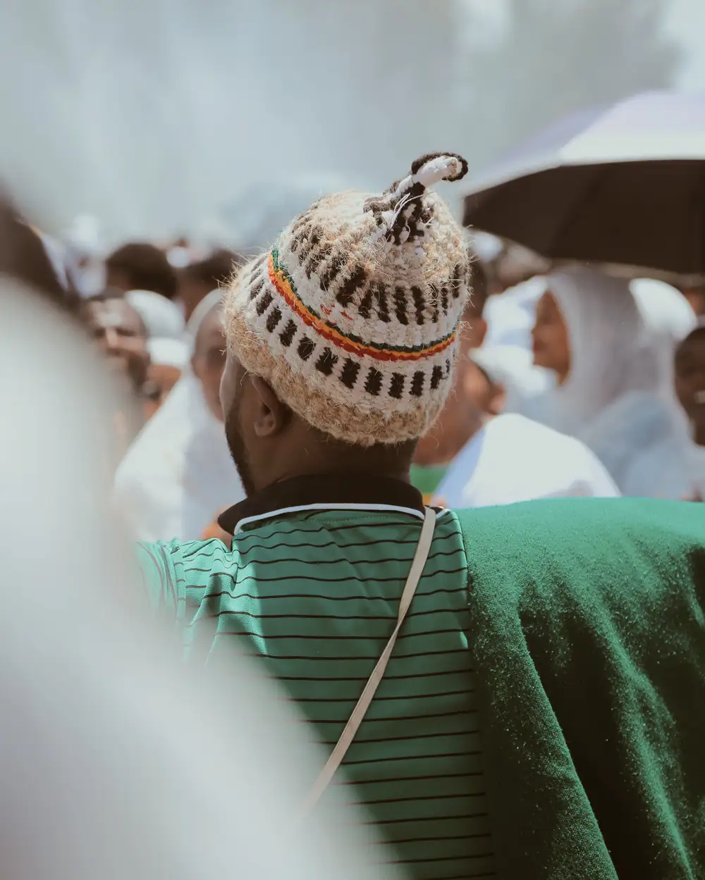 Back of man in green shirt