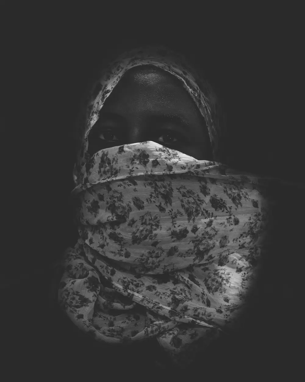 woman with her face wrapped with a scarf