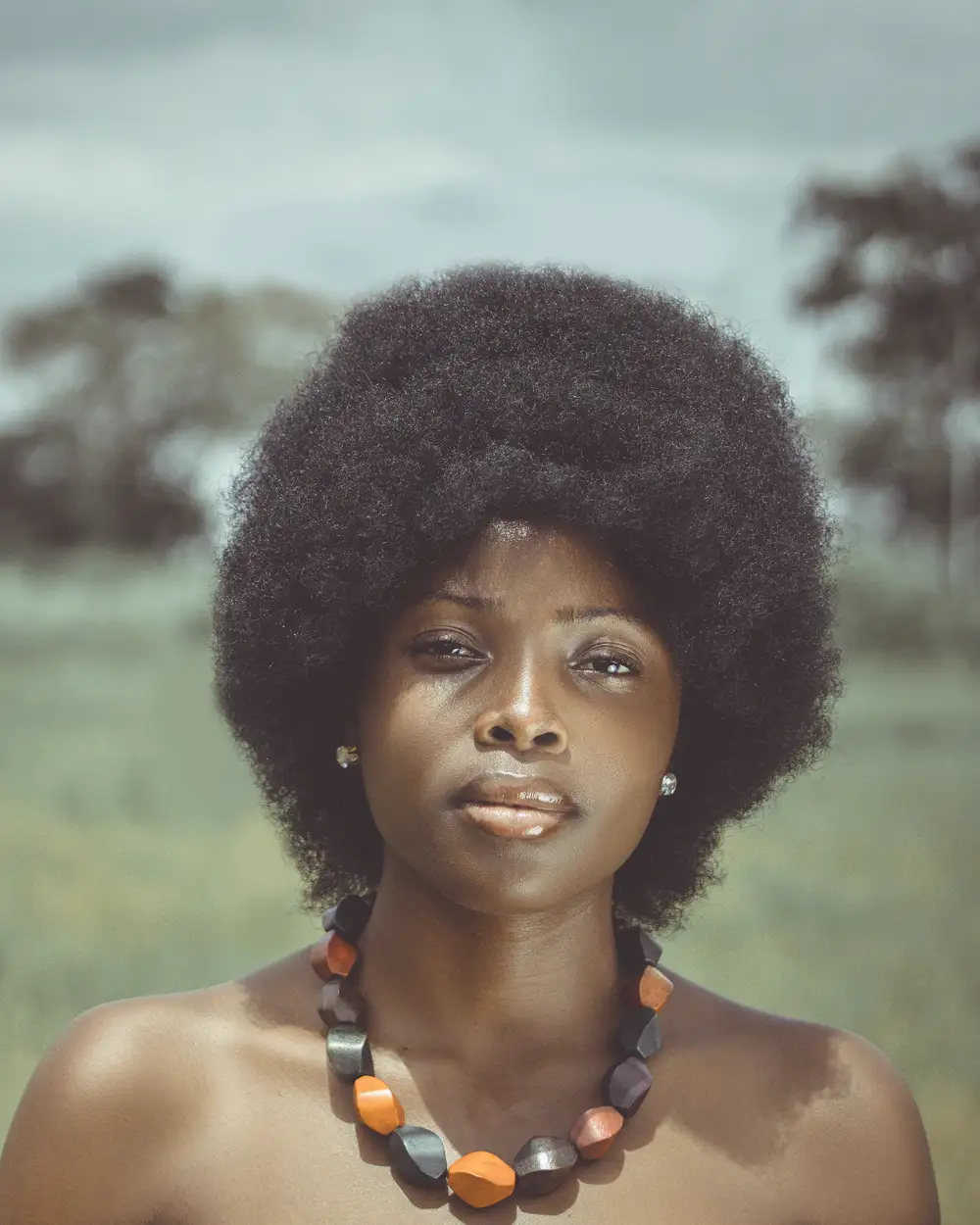 woman with afro and necklace