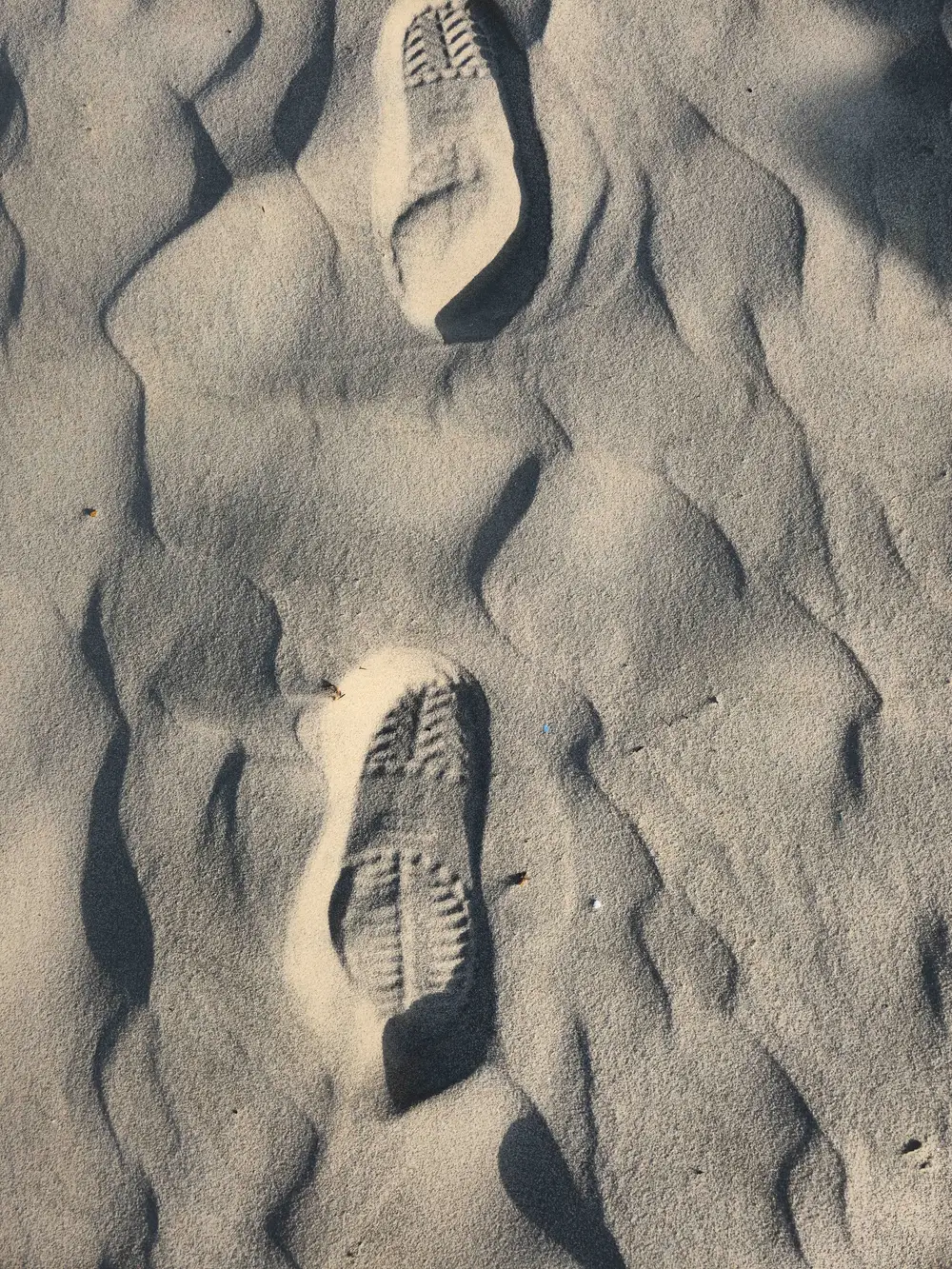 Shoe prints on sand