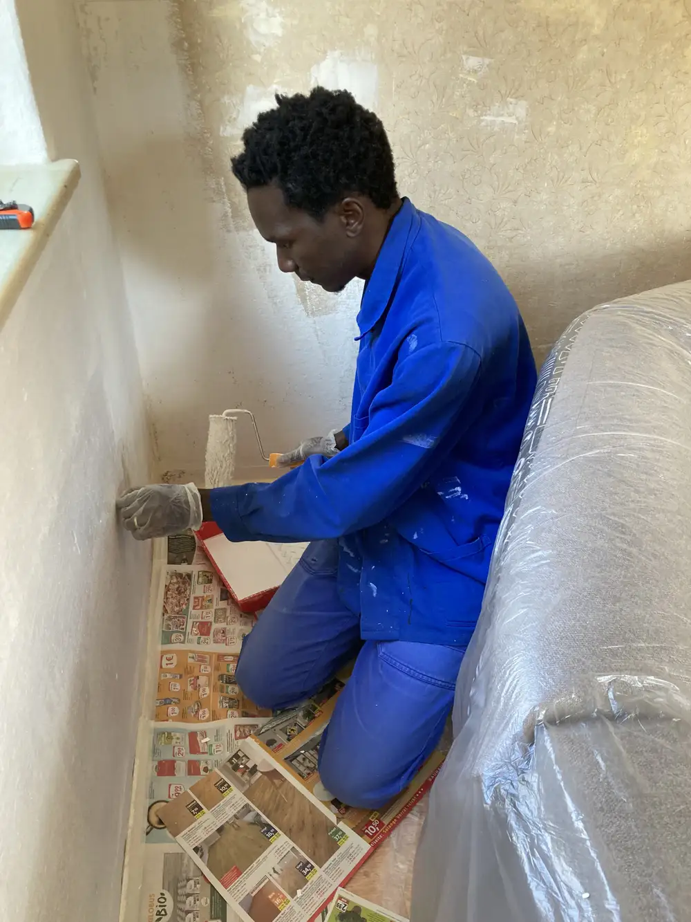 Man repainting a room