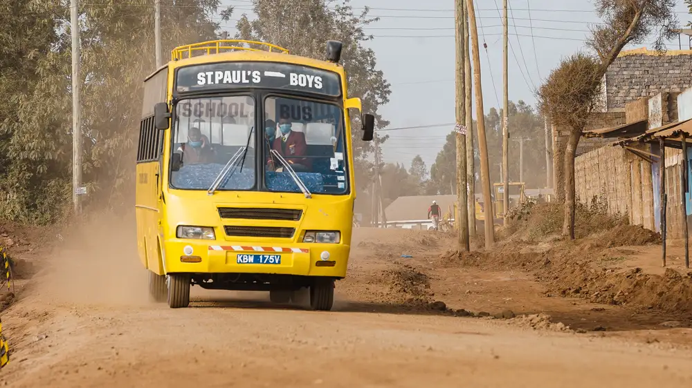 Big city bus on an unconstructed road