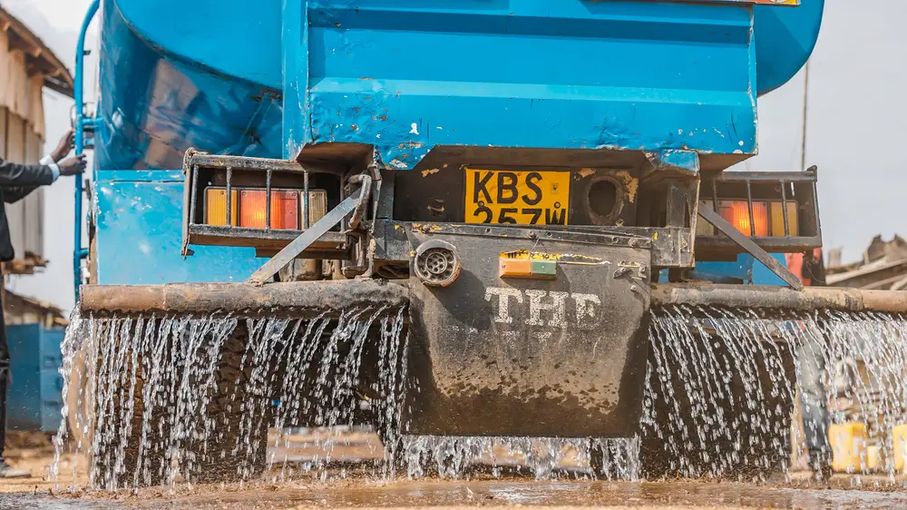 Rear view of a water tanker on  a construction site
