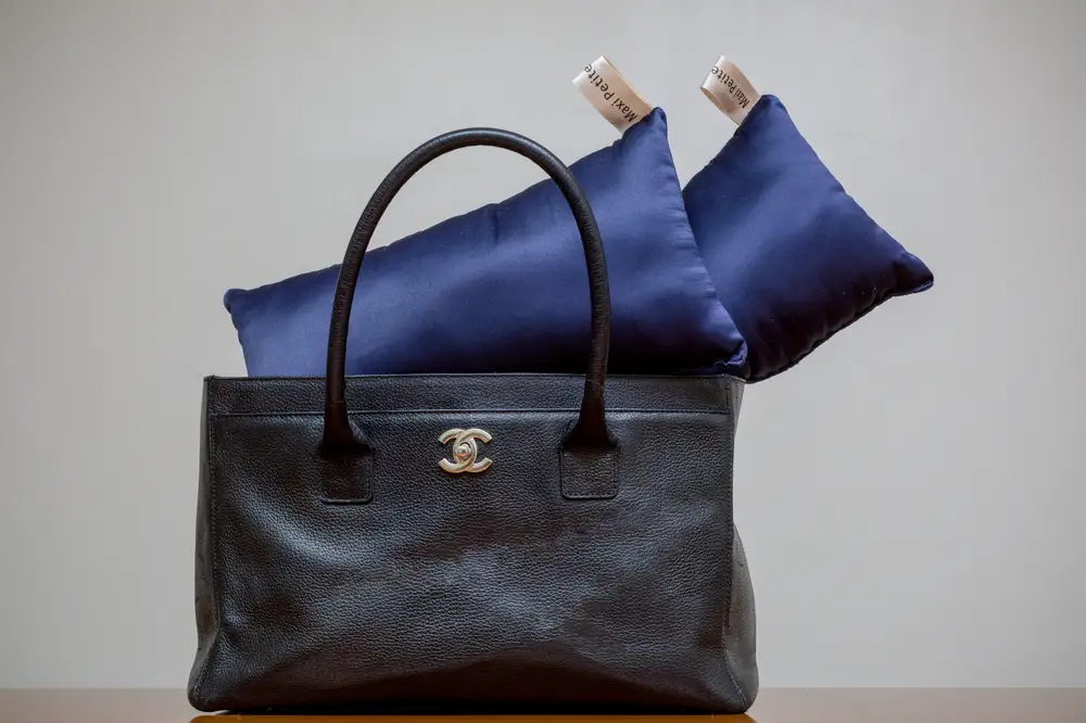 Blue silk billows and a black Chanel bag