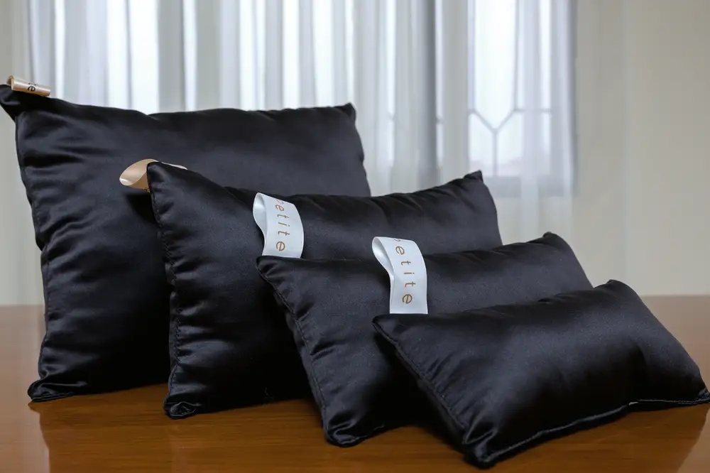 Black pillows of different sizes
