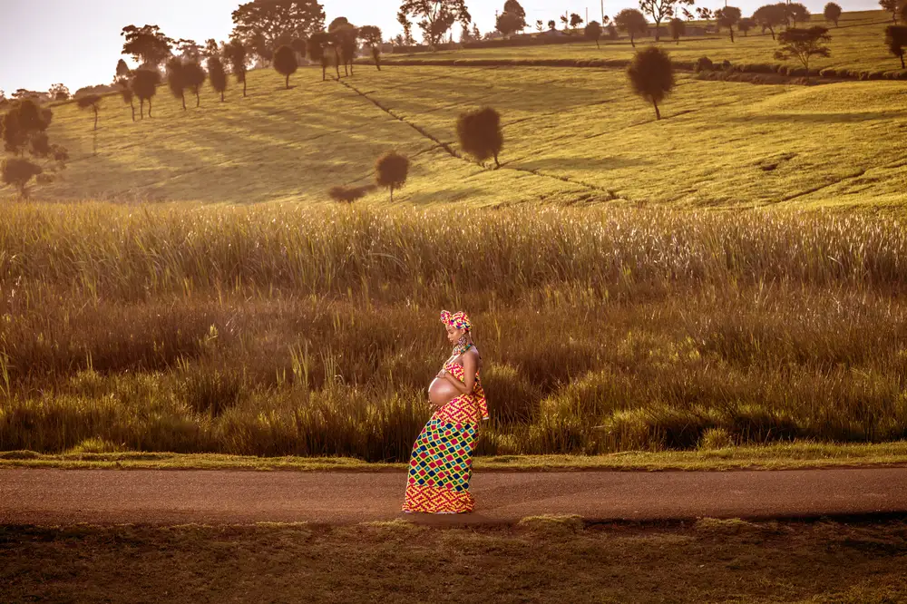 Pregnant woman standing in a field