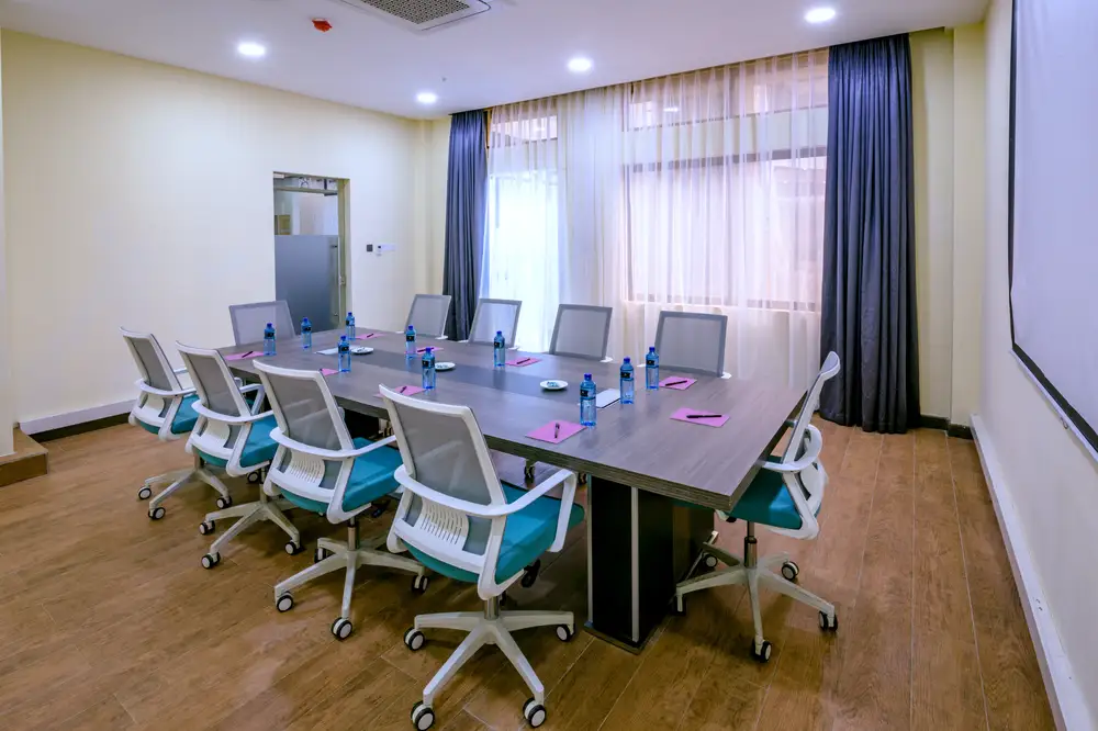 Board room furnished with chairs and a long table