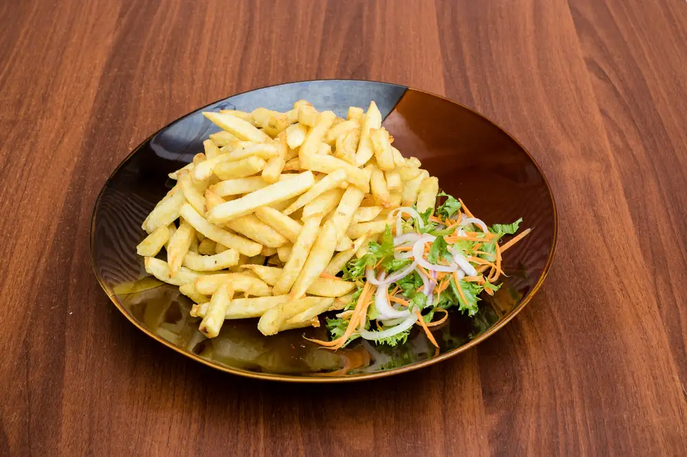 Potato fries and salad