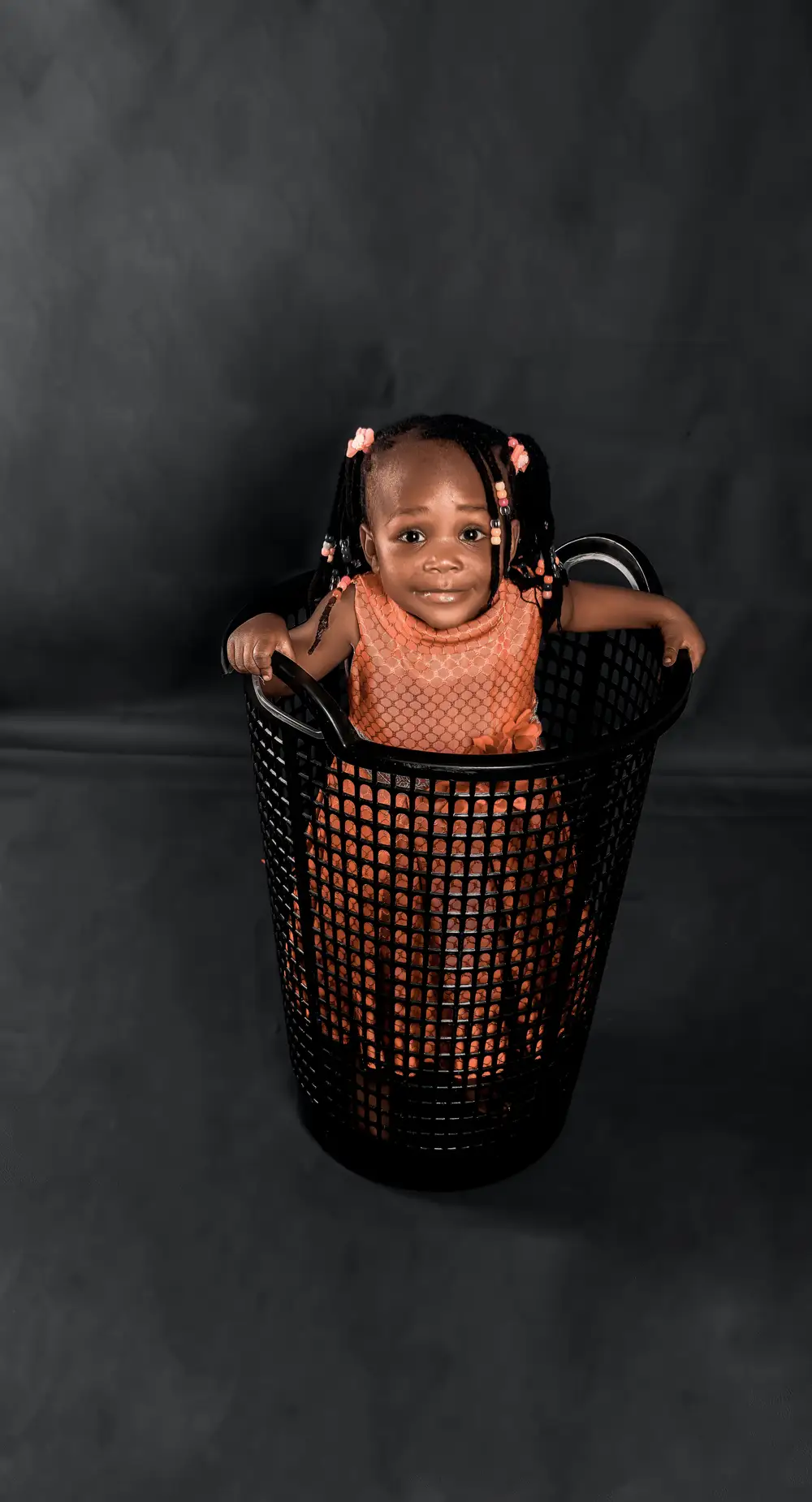 Little girl in a basket