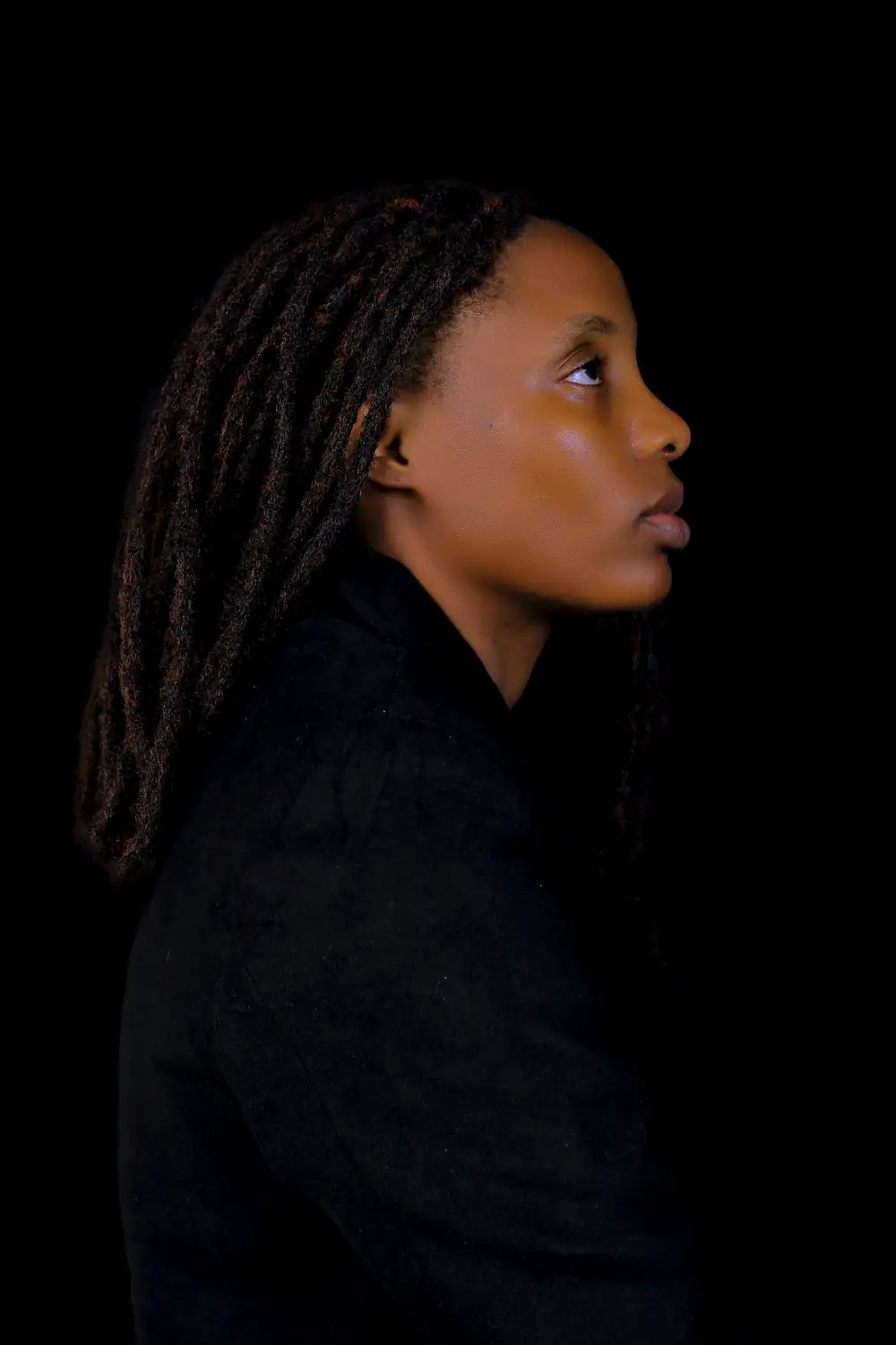 woman with dreads in a suit