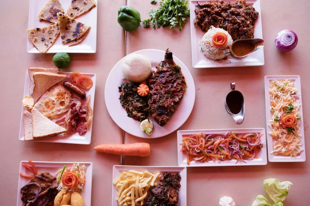 Top view of intercontinental dishes served on a table