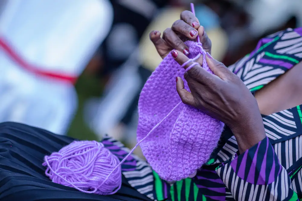 Woman's hand making crochets