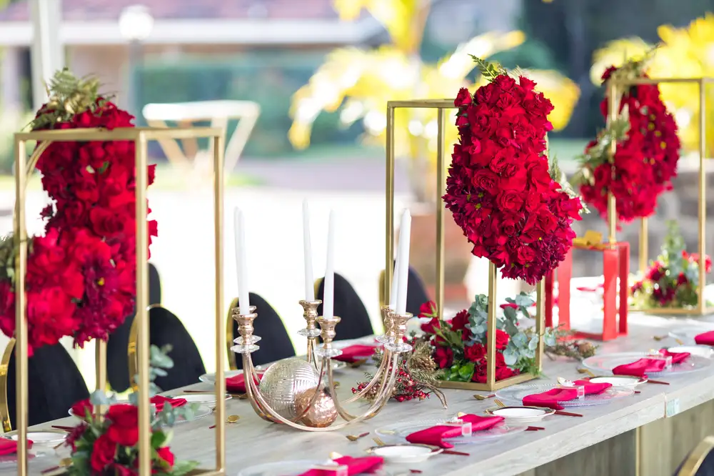Dinning table decorated with red roses