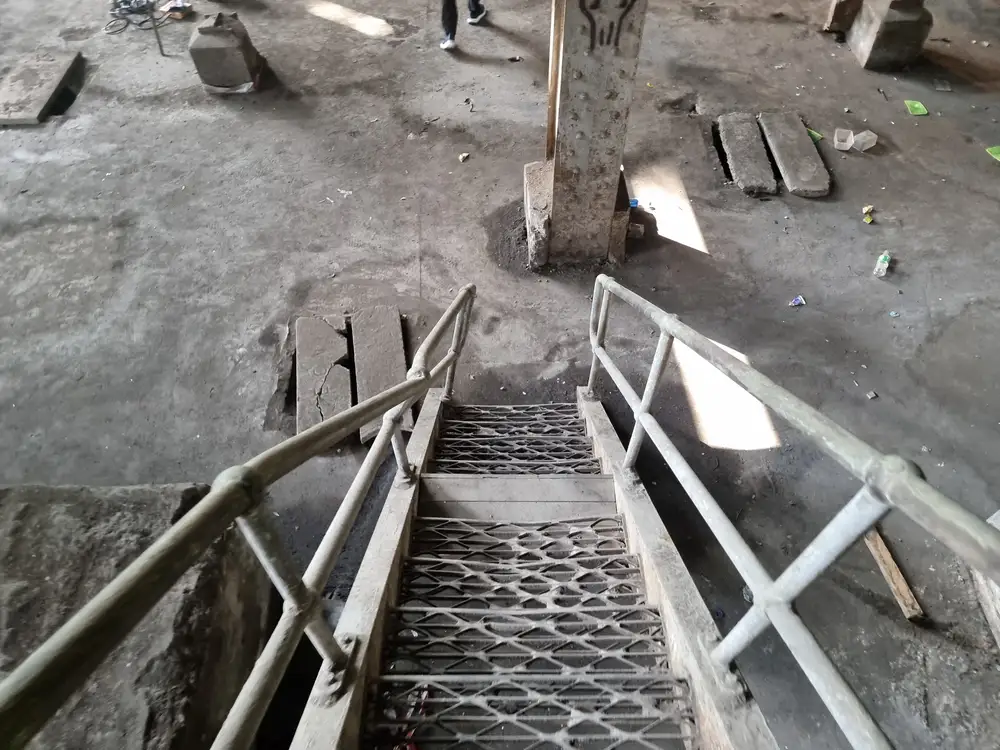Iron staircase on concrete floor