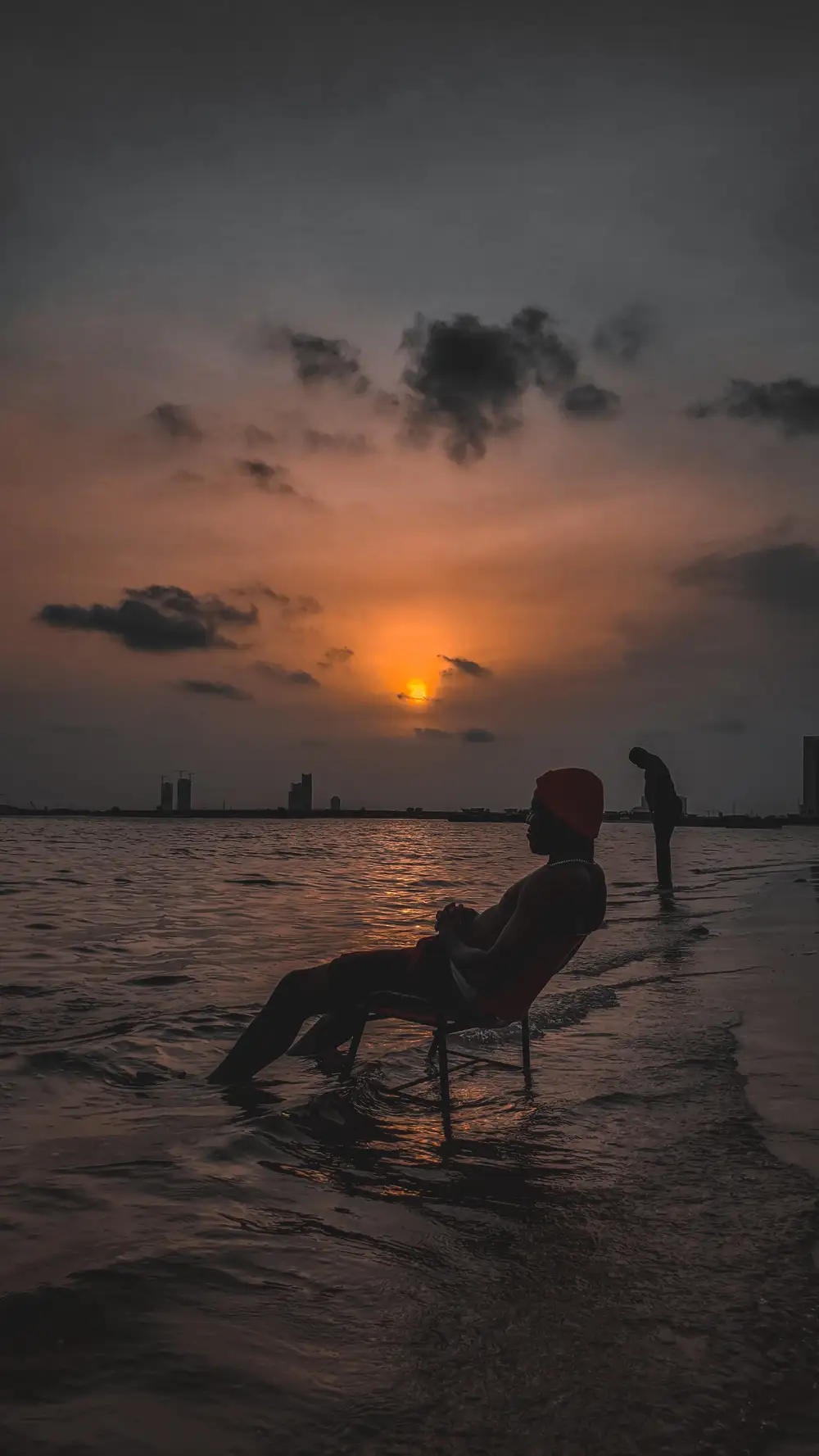 Man sitting on a chair at the beach