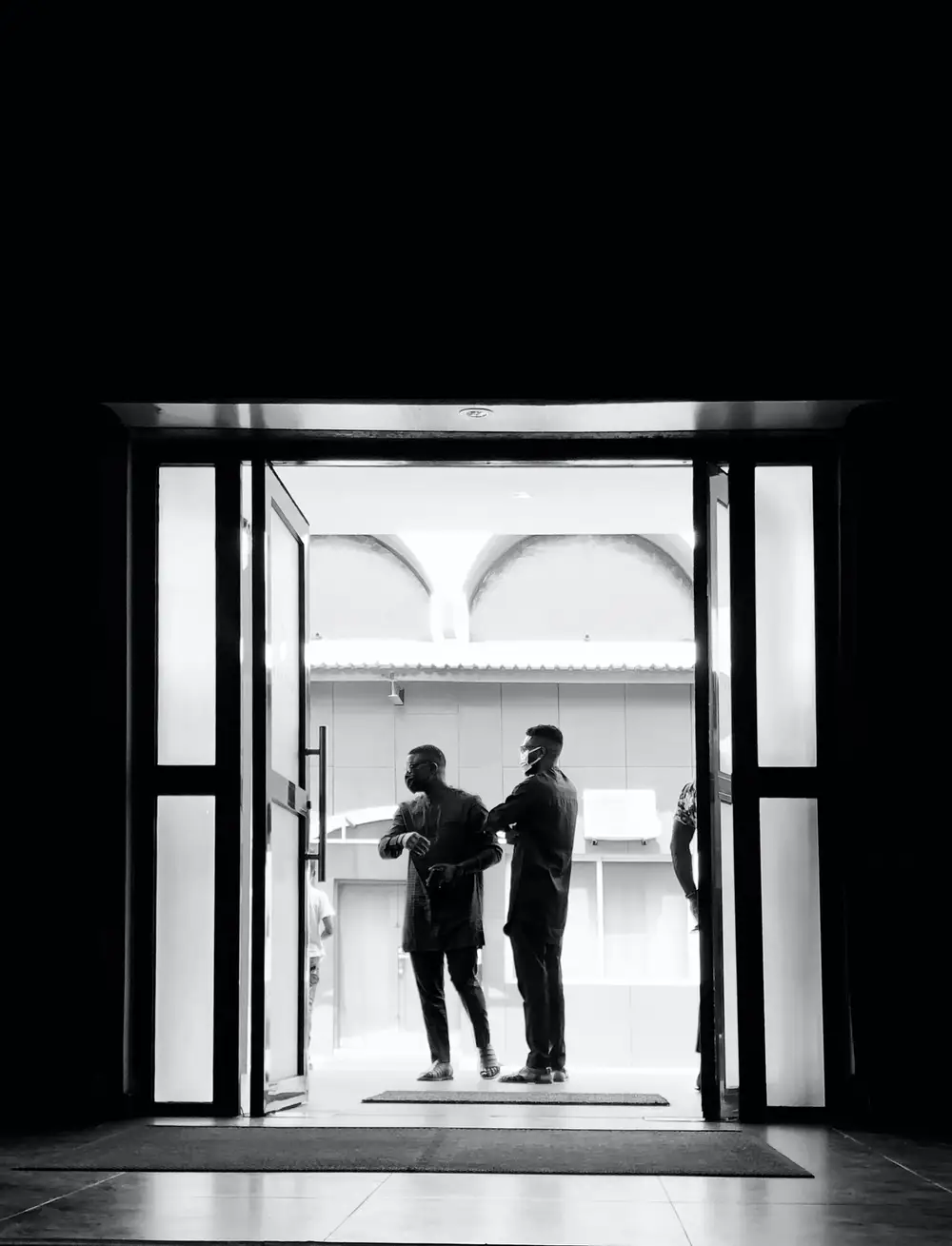Two Men standing in the Hallway