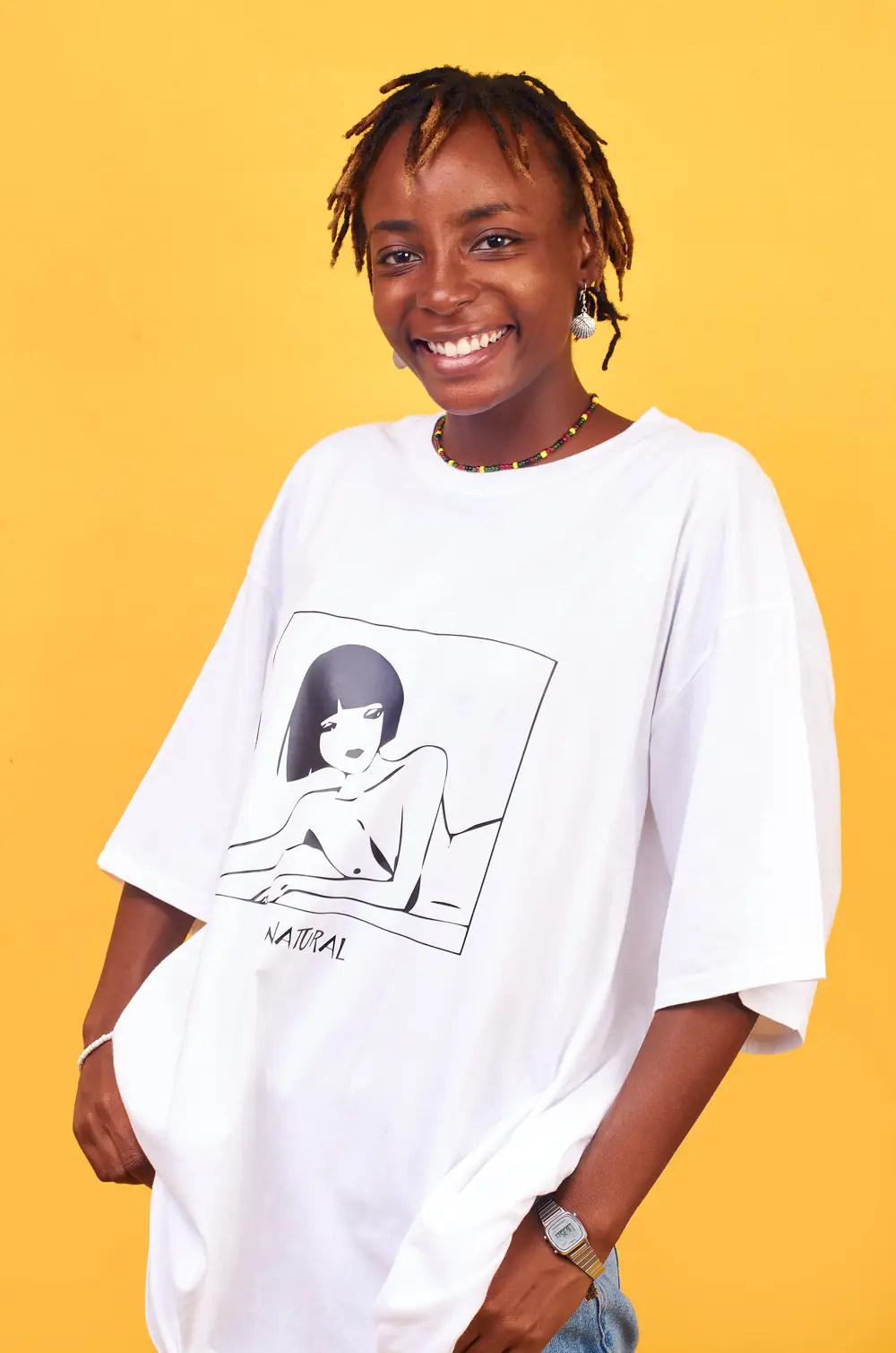A Lady in locs and big shirt