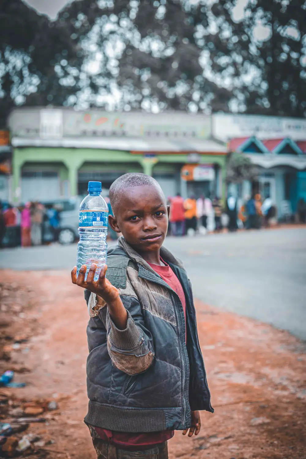 Boy holding a bottle of water