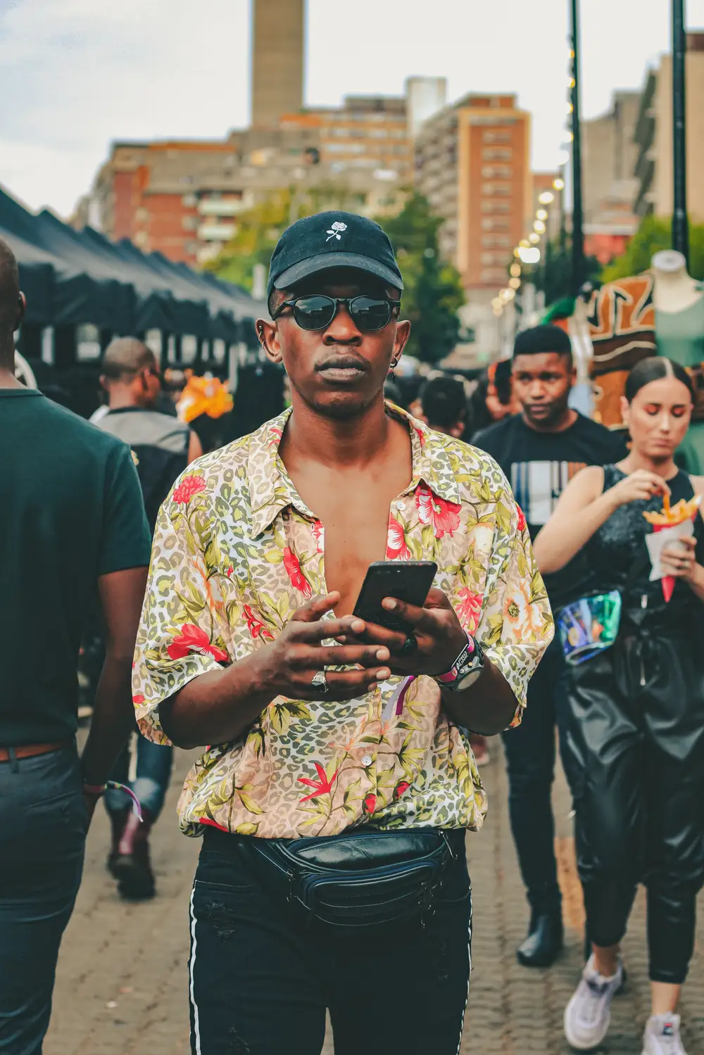 Man with his phone on the street