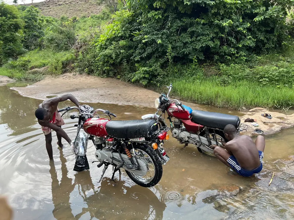 Men washing motorbike