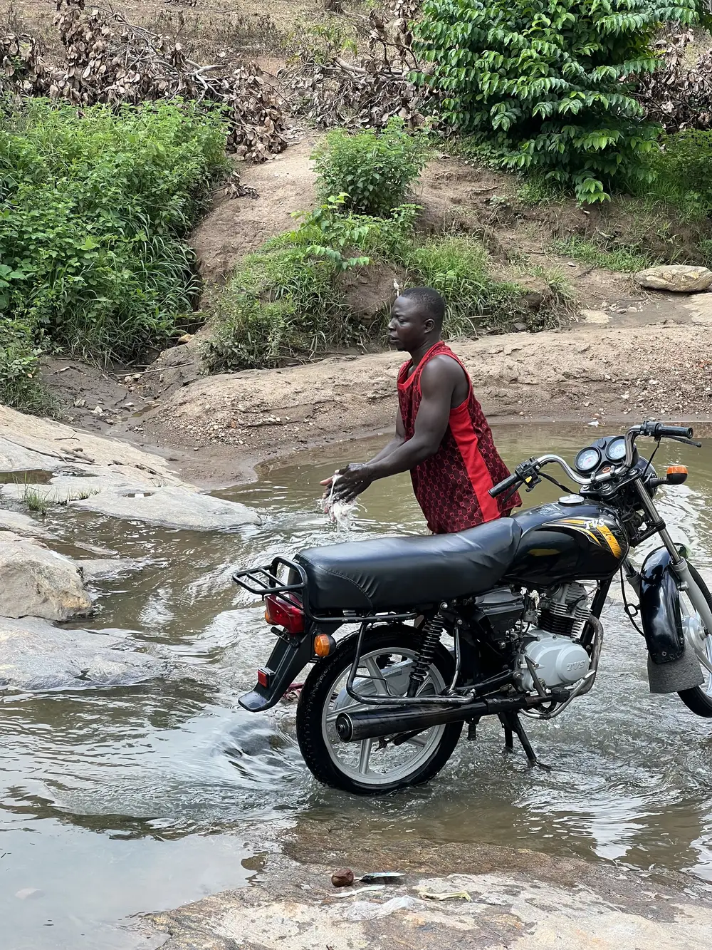 Man washing motorbike