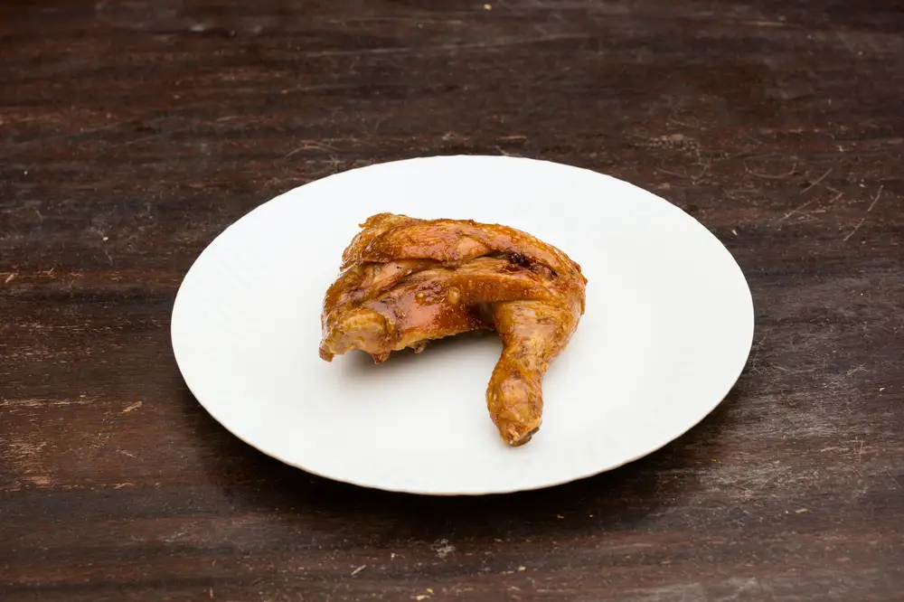 Fried chicken thigh on a plate