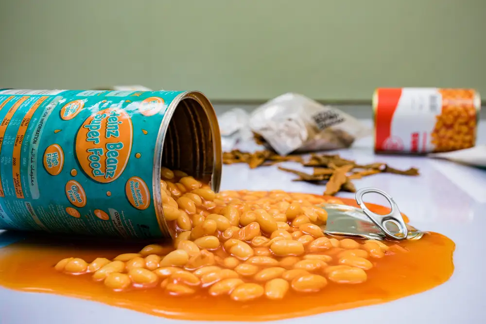 Baked beans pouring out of the can