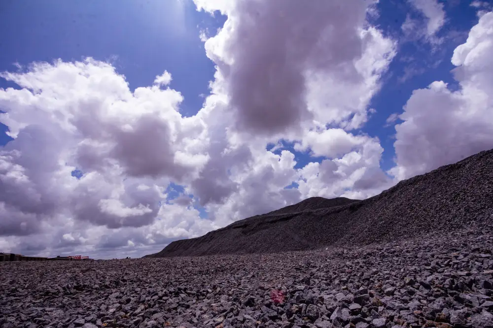 Gravels and granite under a cloudy bright sky
