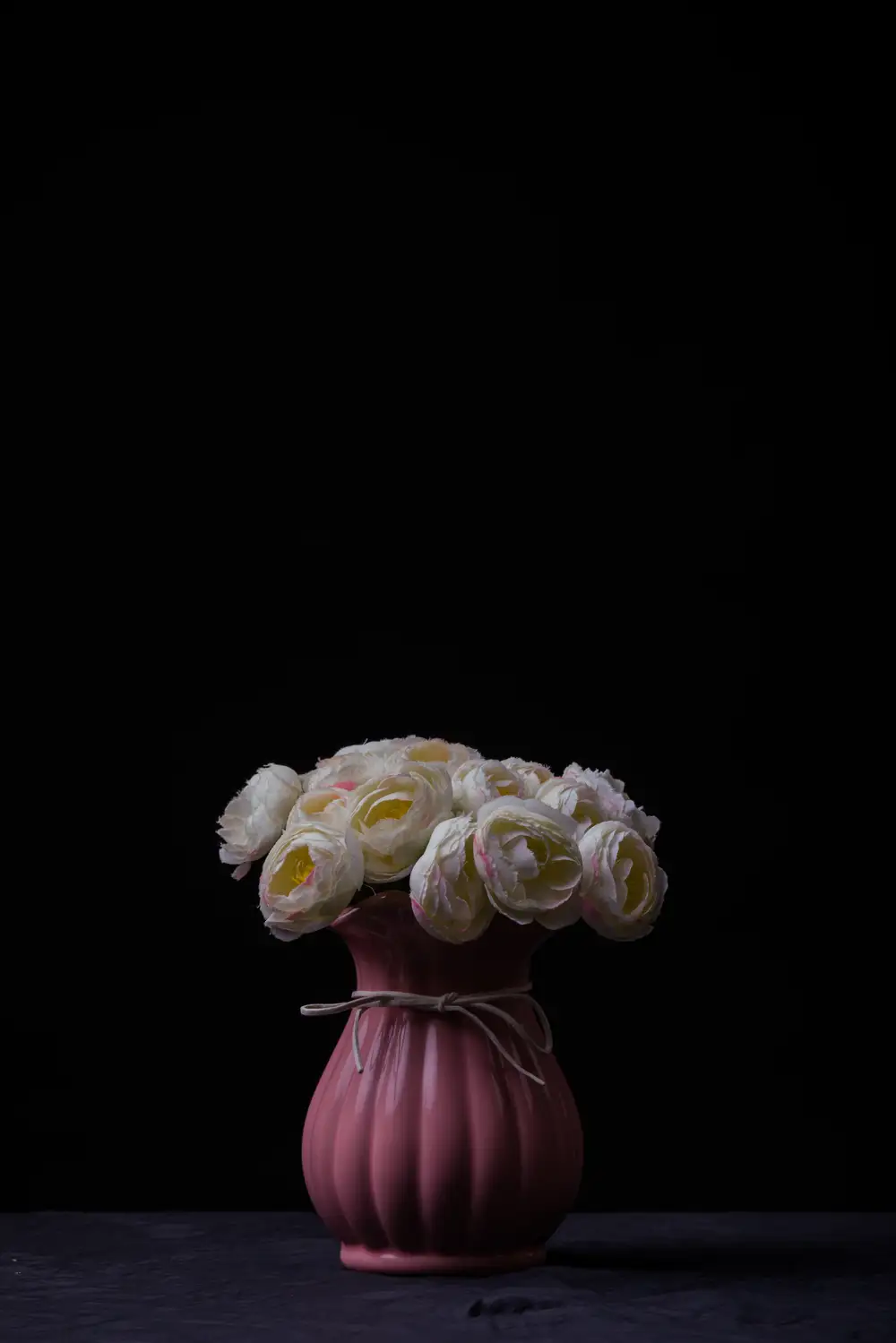 Blooming flowers in a pink vase