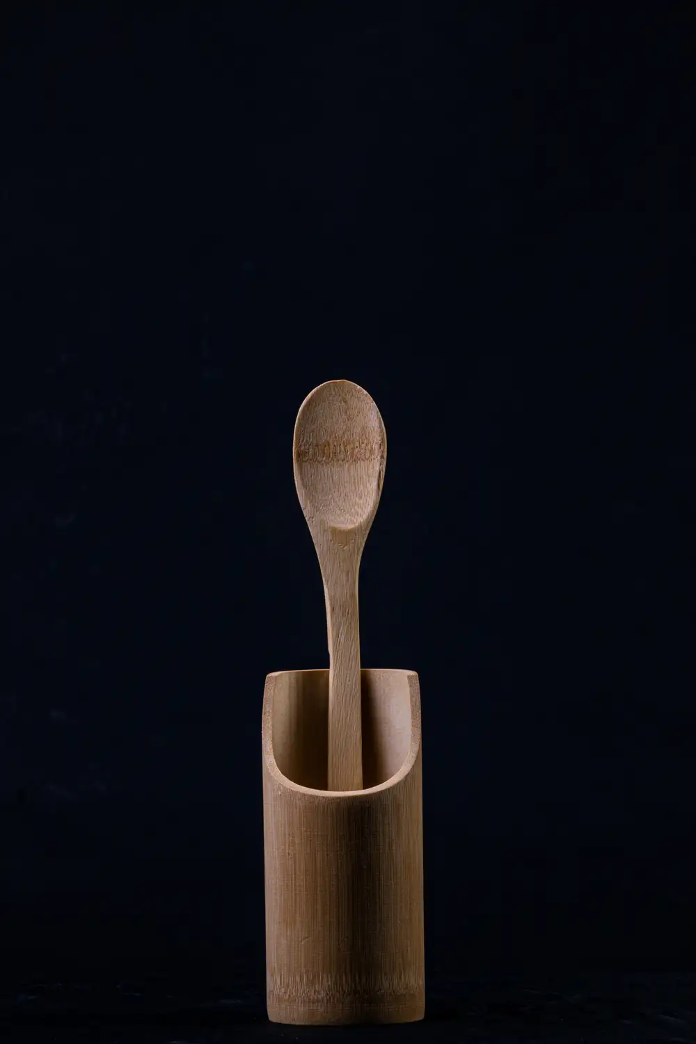 Wooden spoon with  a blue backdrop