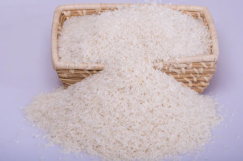 White rice grains in a hand woven basket