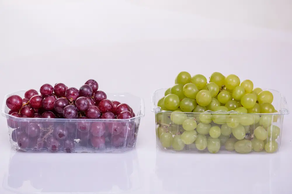 Red and Green grapes in transparent bowls