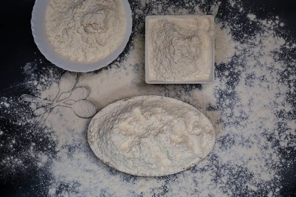 Different shapes of bowls of white  flour