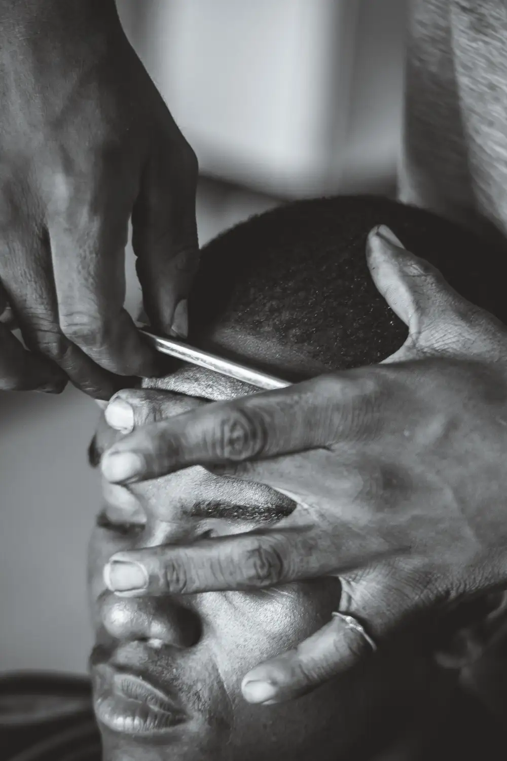 man getting his hair cut