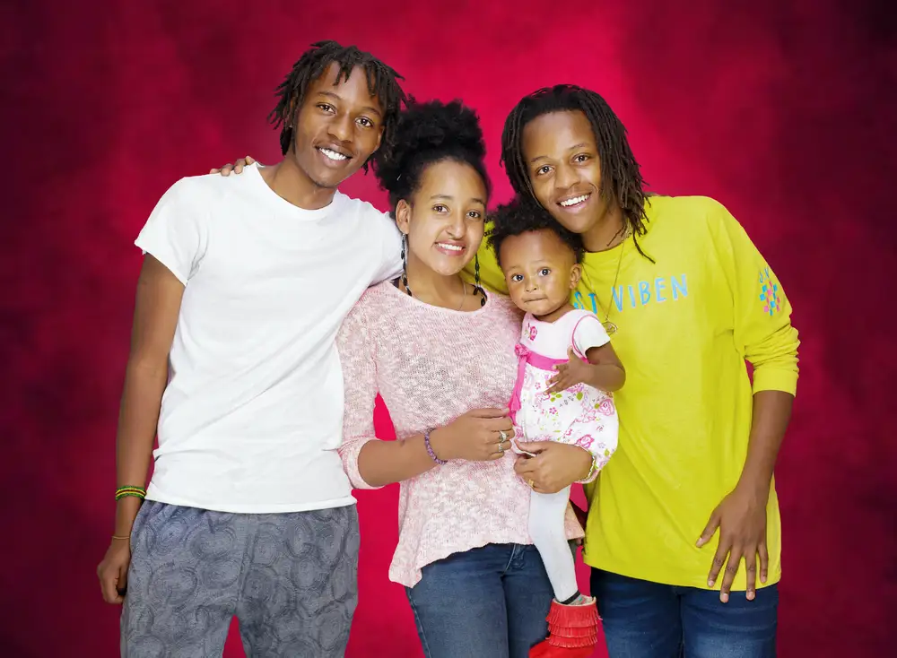 A young couple and their daughter in a photoshoot