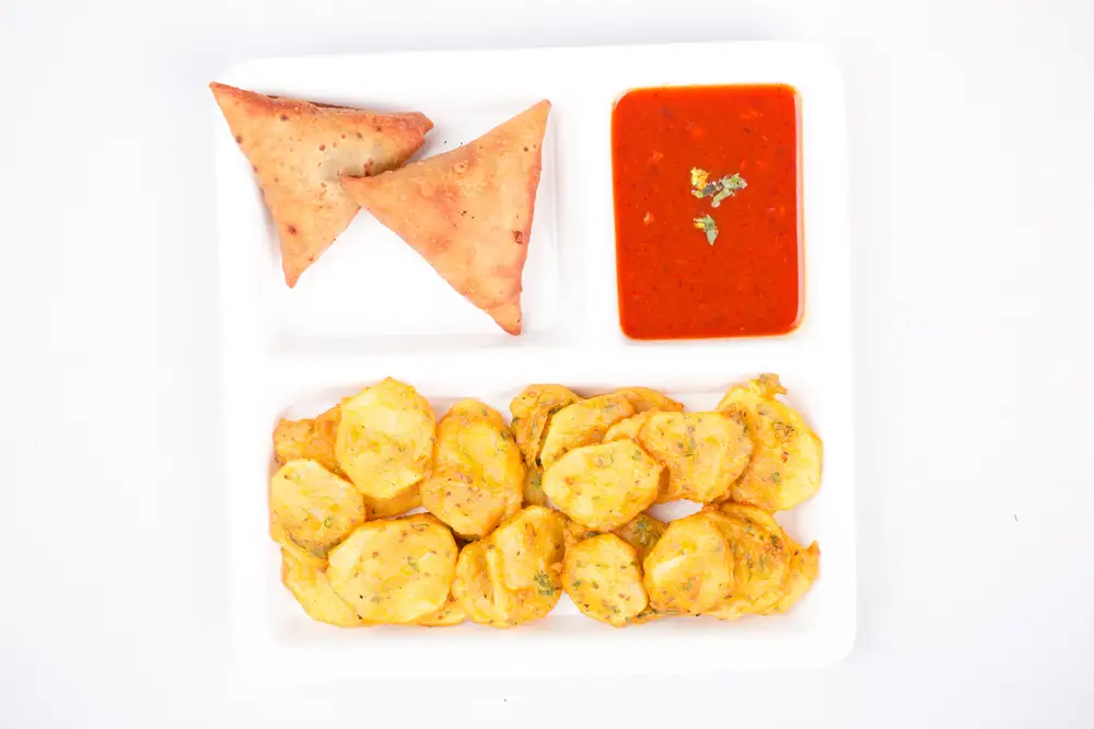 Chickedn samosa with fried Potato and sauce