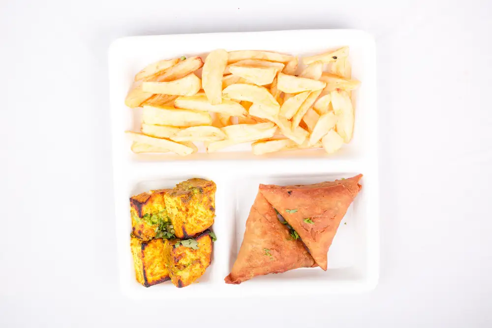 French fries served with Samosa and fried plantain