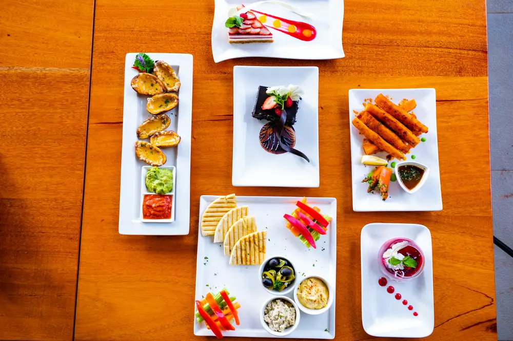 Colorful appetizers served in white plates