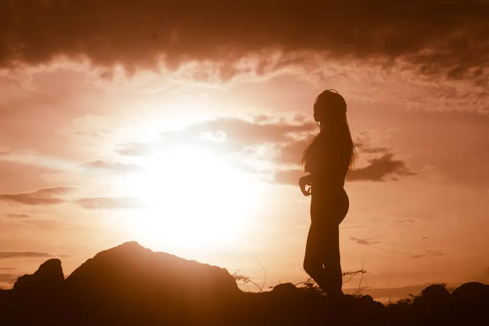 woman looking at  the sunset