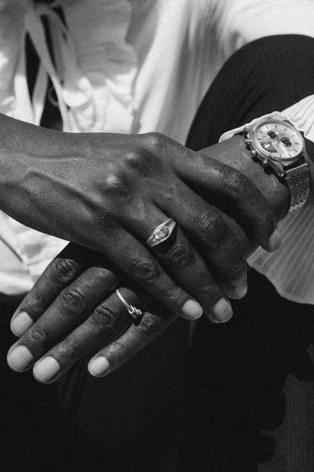 hands with rings and a wristwatch