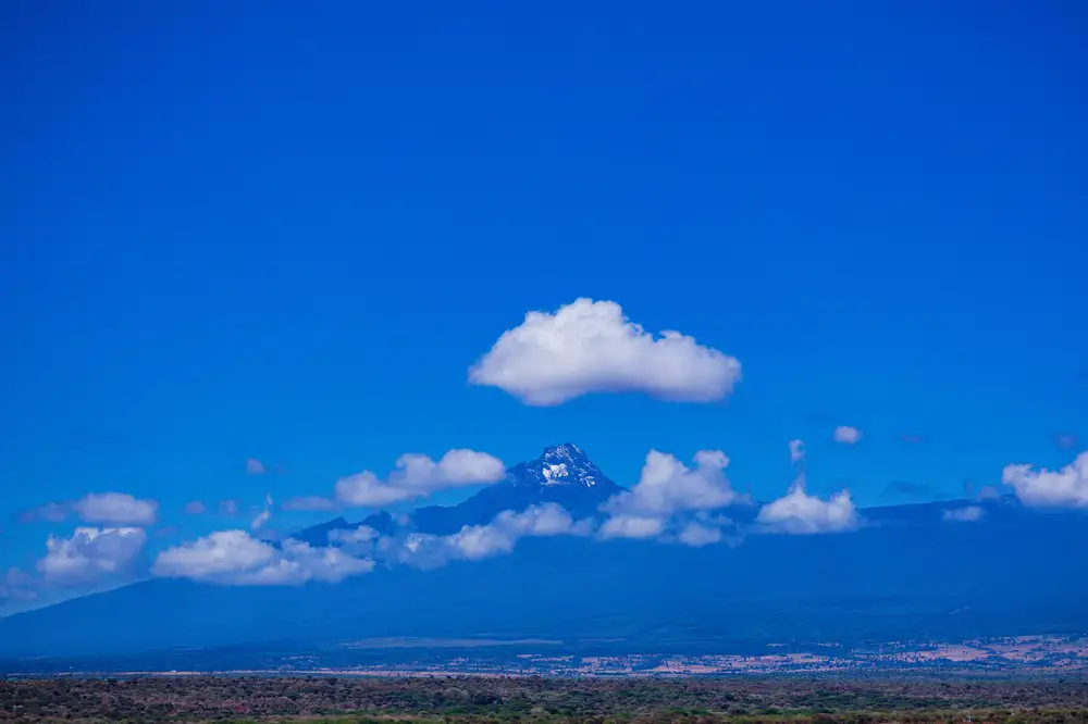 Kilimanjaro rising through blue sky