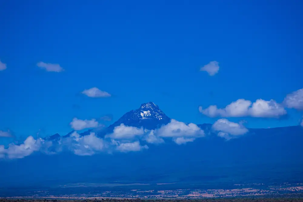 Kilimanjaro rising through blue sky
