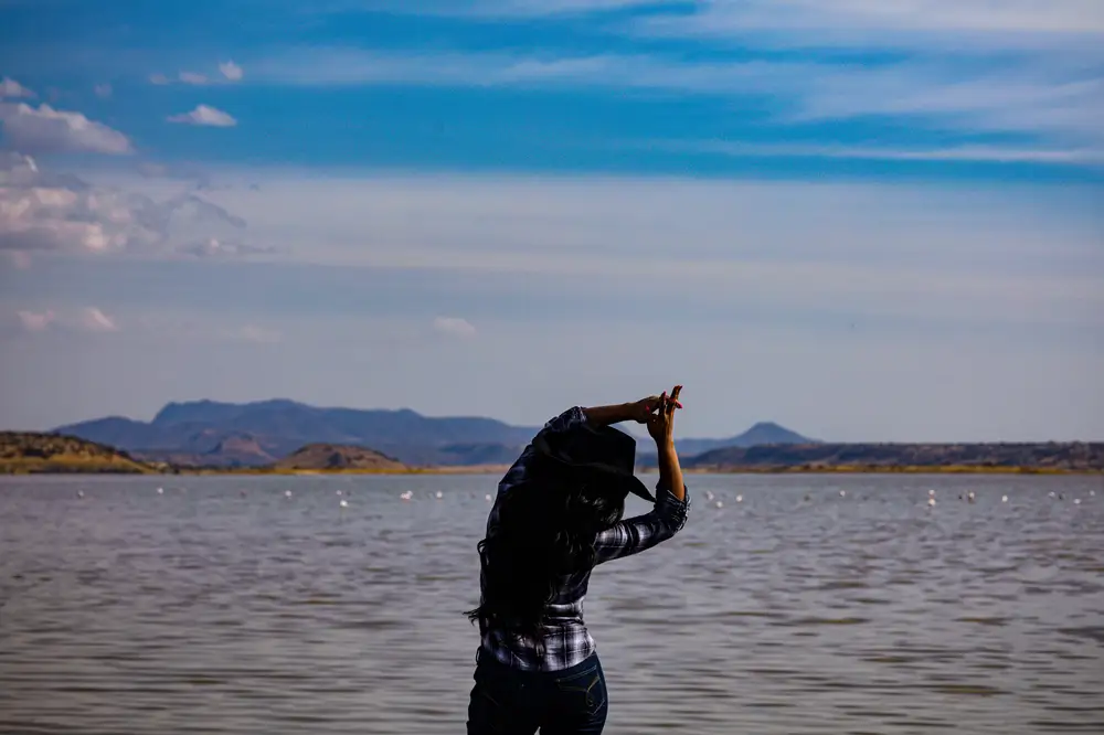 Lady dancing beside the lake